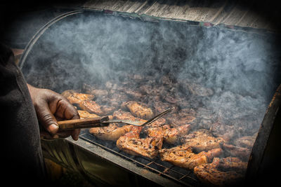 High angle view of meat on barbecue grill