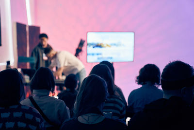 Rear view of people at home