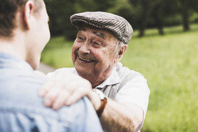 Portrait of happy senior man with his grandson