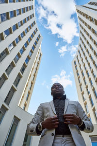 African american businessman between buildings. person
