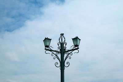 Low angle view of street light against sky