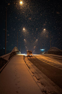 Road in city at night during winter