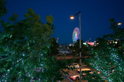 Low angle view of illuminated street light at night