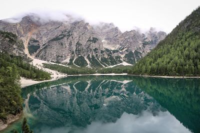 Scenic view of lake and mountains against sky