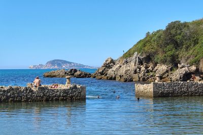 Scenic view of sea against clear blue sky