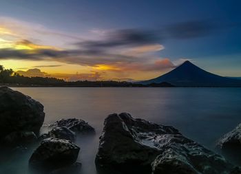 Panoramic view of sea against sky during sunset