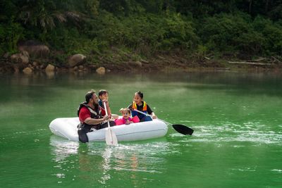 People on boat in lake