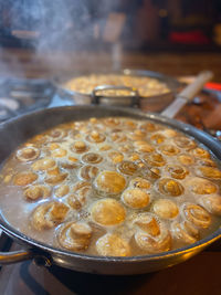 Close-up of  mushrooms in cooking pan