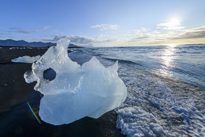 Scenic view of sea against sky during winter