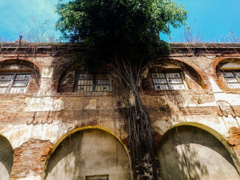 Low angle view of old building against sky