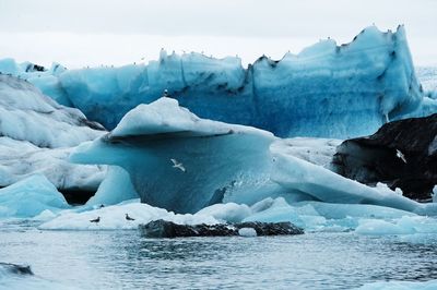 Scenic view of frozen lake against sky