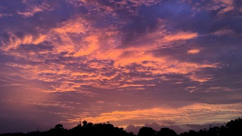 Low angle view of dramatic sky during sunset