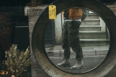 Rear view of man standing in bus