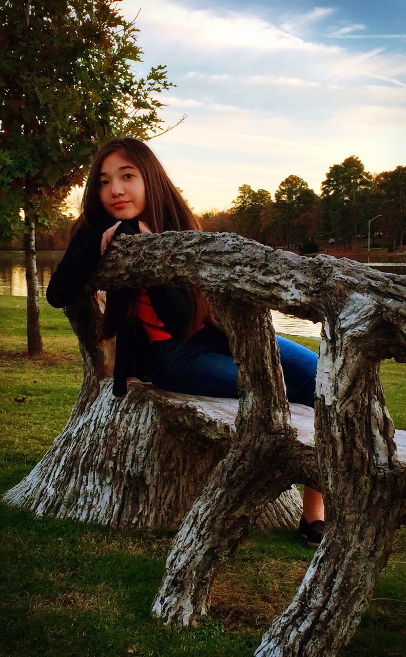 person, young adult, portrait, looking at camera, tree, casual clothing, smiling, young women, leisure activity, front view, lifestyles, happiness, full length, three quarter length, standing, sky, long hair