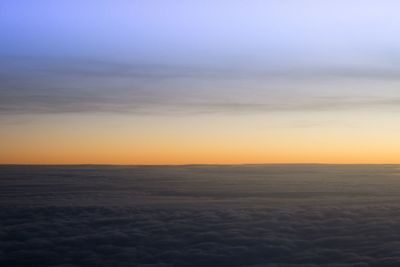 Scenic view of sea against sky at sunset