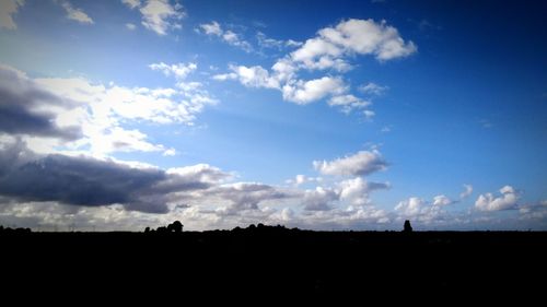 Silhouette landscape against sky