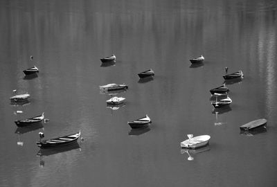 High angle view of boats moored in lake against sky