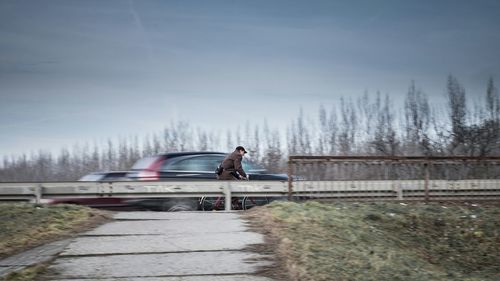 Cars on road against sky