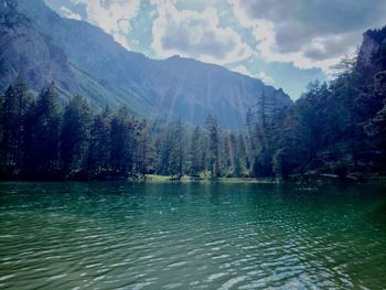 Scenic view of lake with mountains in background