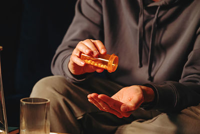 Midsection of man playing chess