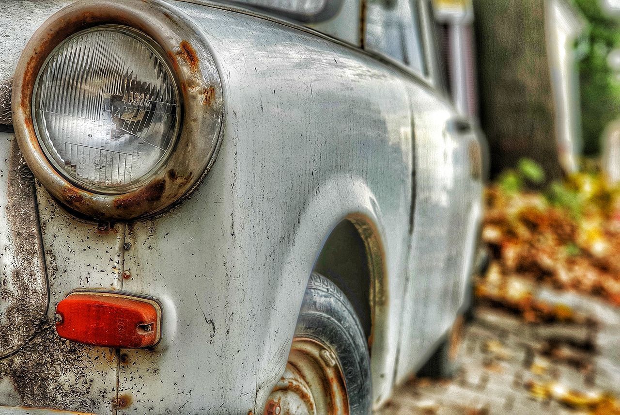 CLOSE-UP OF RUSTY CAR