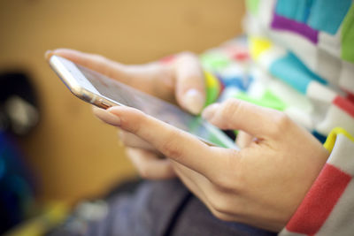  high angle view of woman  hands using mobile phone