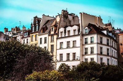 Low angle view of residential building against sky in paris