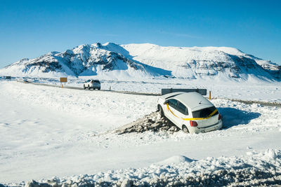 Crashed car in snow