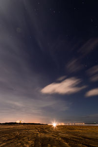 Scenic view of a beach landscape against sky at night