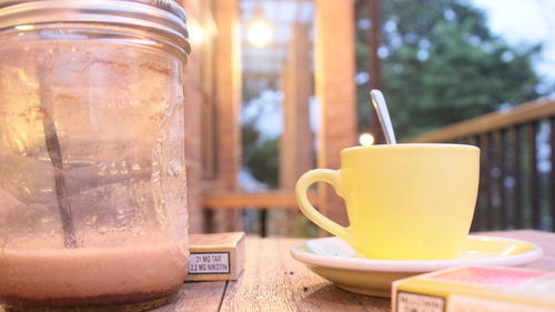 Close-up of coffee cup on table