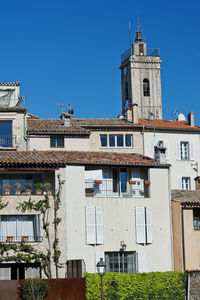 Low angle view of building against clear blue sky