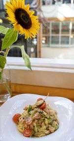 Close-up of flowers in plate on table