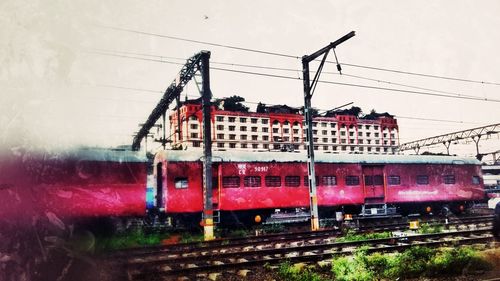 Train on railroad track against sky