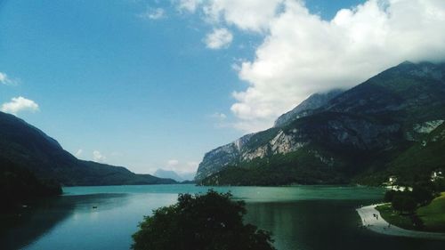 Scenic view of lake and mountains against sky