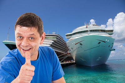 Portrait of mid adult man in sea against blue sky