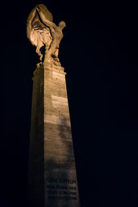 Low angle view of statue against sky