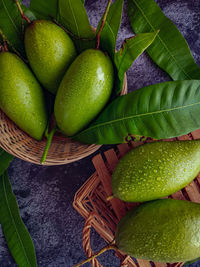 High angle view of fruits in basket on table