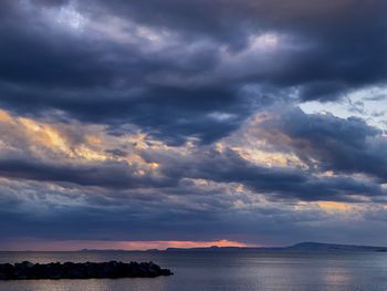 Scenic view of sea against dramatic sky
