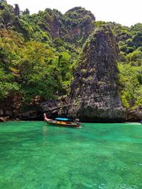 Scenic view of sea against rock formation