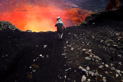 Rear view of man standing on land