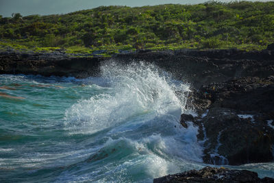 Sea waves splashing on rocks