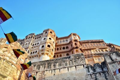 Mehrangarh fort, low angle view of historical building against clear blue sky