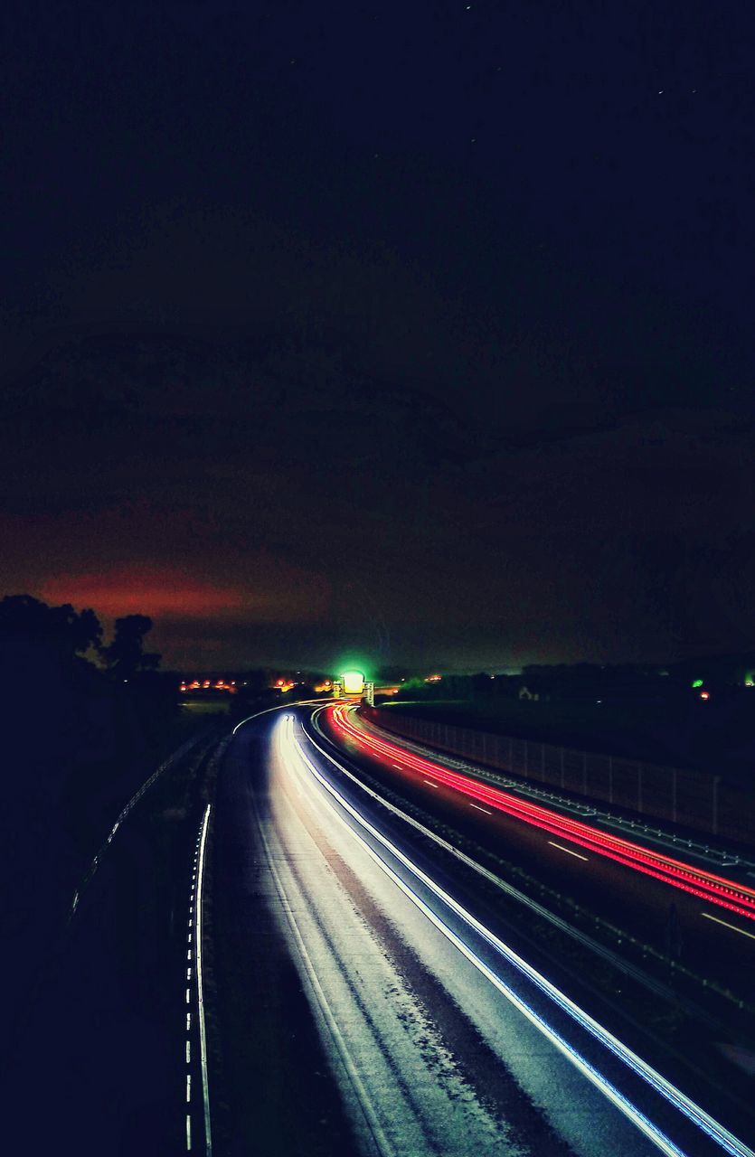 TRAFFIC ON ROAD AT NIGHT