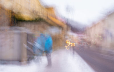 Rear view of man walking on street