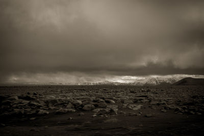 Scenic view of sea against storm clouds