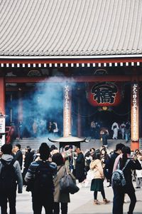 People in front of building