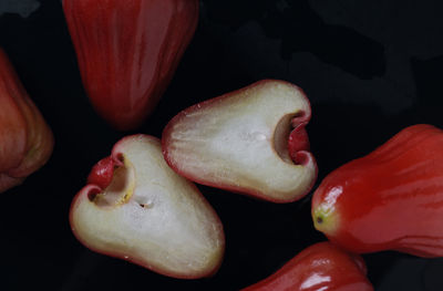 High angle view of fruits on black background