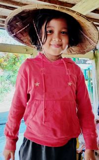 Portrait of smiling girl in hat