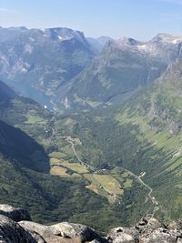 High angle view of valley and mountains against sky