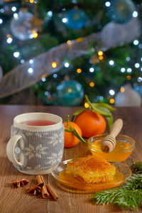 Close-up of hot drink and christmas decorations